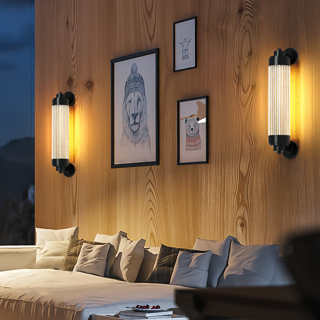 Warm glowing outdoor wall lighting LED sconces installed on a wooden wall in a cozy evening patio setting.
