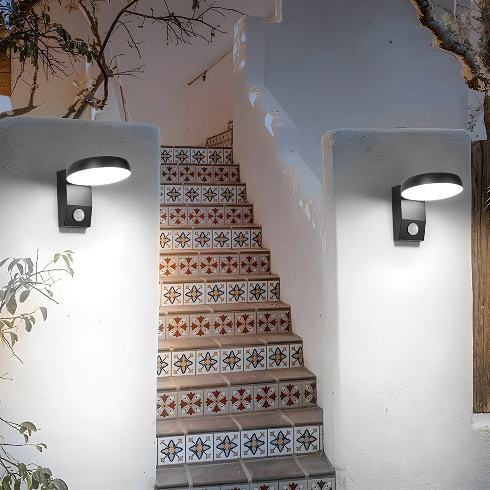 Outdoor wall lights with motion sensor enhancing a staircase with patterned tiles.