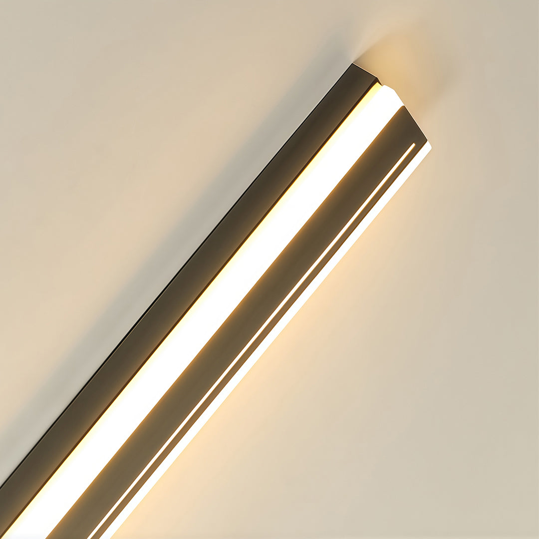 Multiple outdoor wall mount lighting fixtures on contemporary residential building facade at dusk