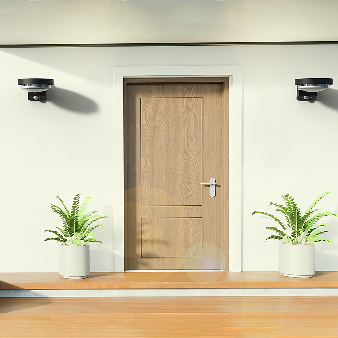 Pair of modern outdoor wall sconces framing a wooden front door with clean lighting.