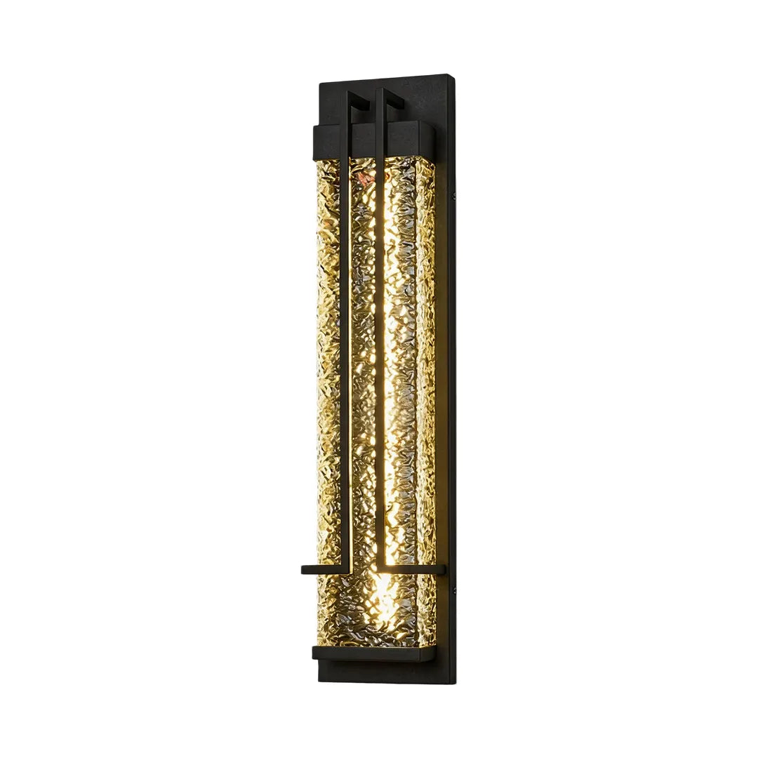 Outdoor wall sconce with vertical textured glass and black metal housing