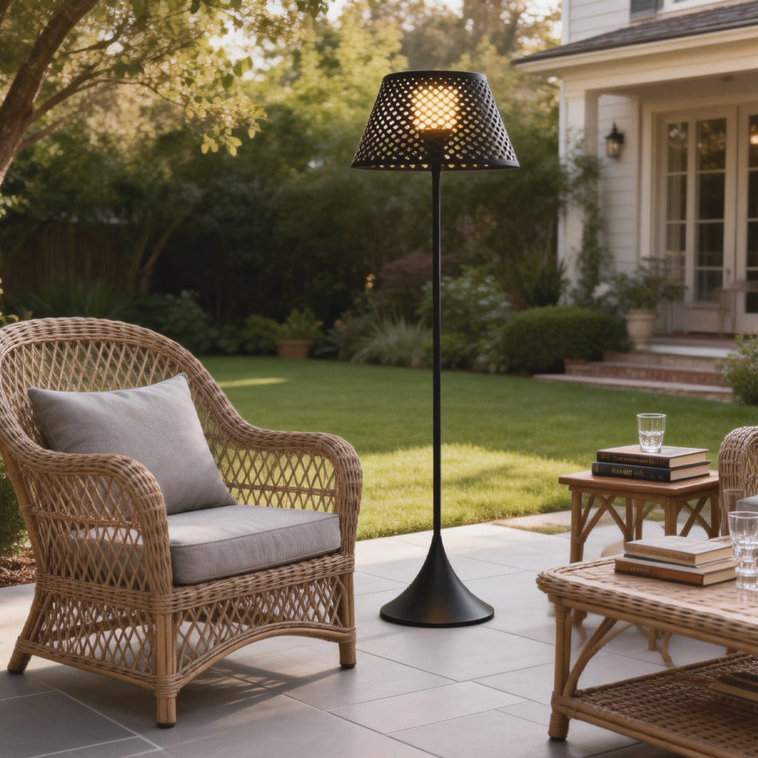 Outdoor waterproof floor lamps placed on a patio seating area, featuring woven shade design and warm ambient lighting.