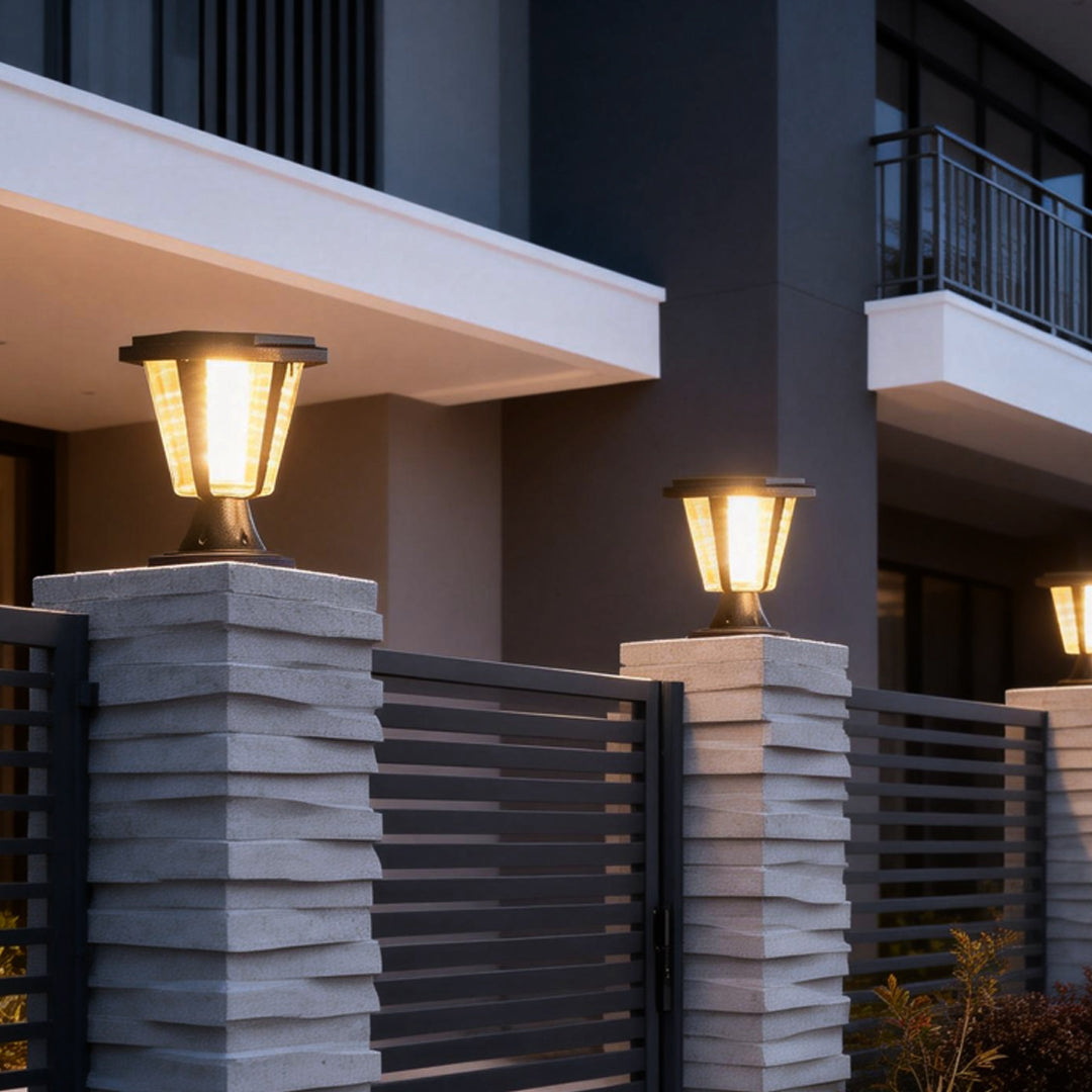 Outdoor waterproof post lamp providing soft illumination along a residential fence.