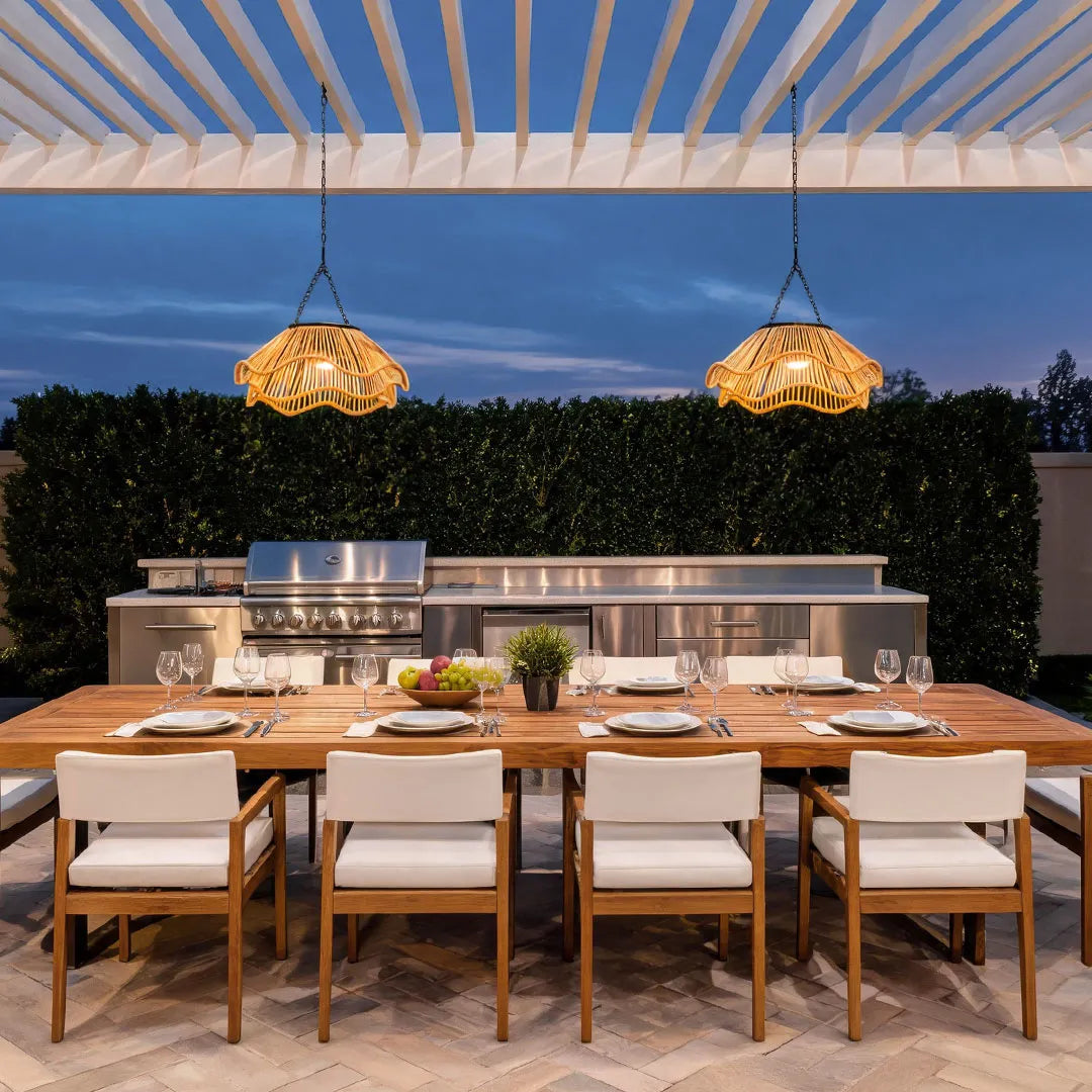 Outdoor woven pendant light illuminating a covered dining area with warm decorative lighting.