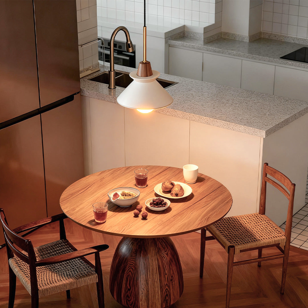 Outdoor oval bulkhead lights mounted along a wooden fence for pathway illumination.