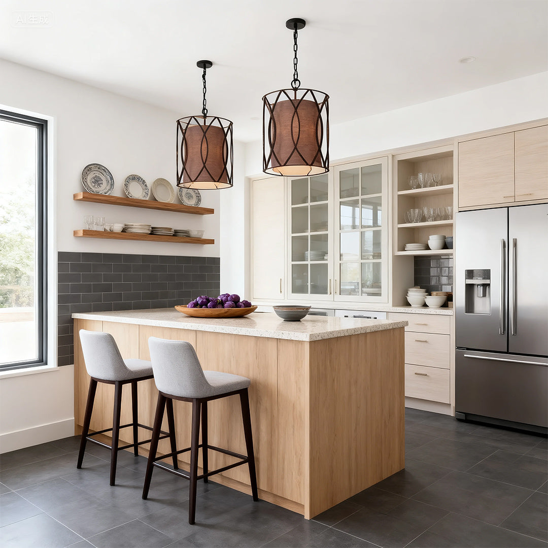 Pair of caged small black pendant light fixtures hanging over a natural wood kitchen island with white countertops.