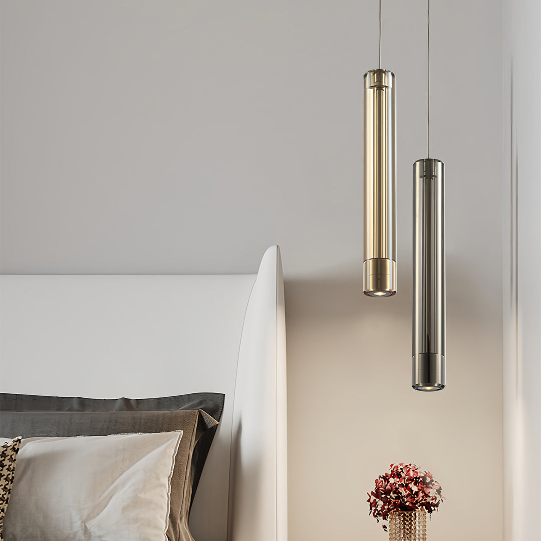 Pair of double hanging pendant lights flanking bed in contemporary bedroom with neutral color palette