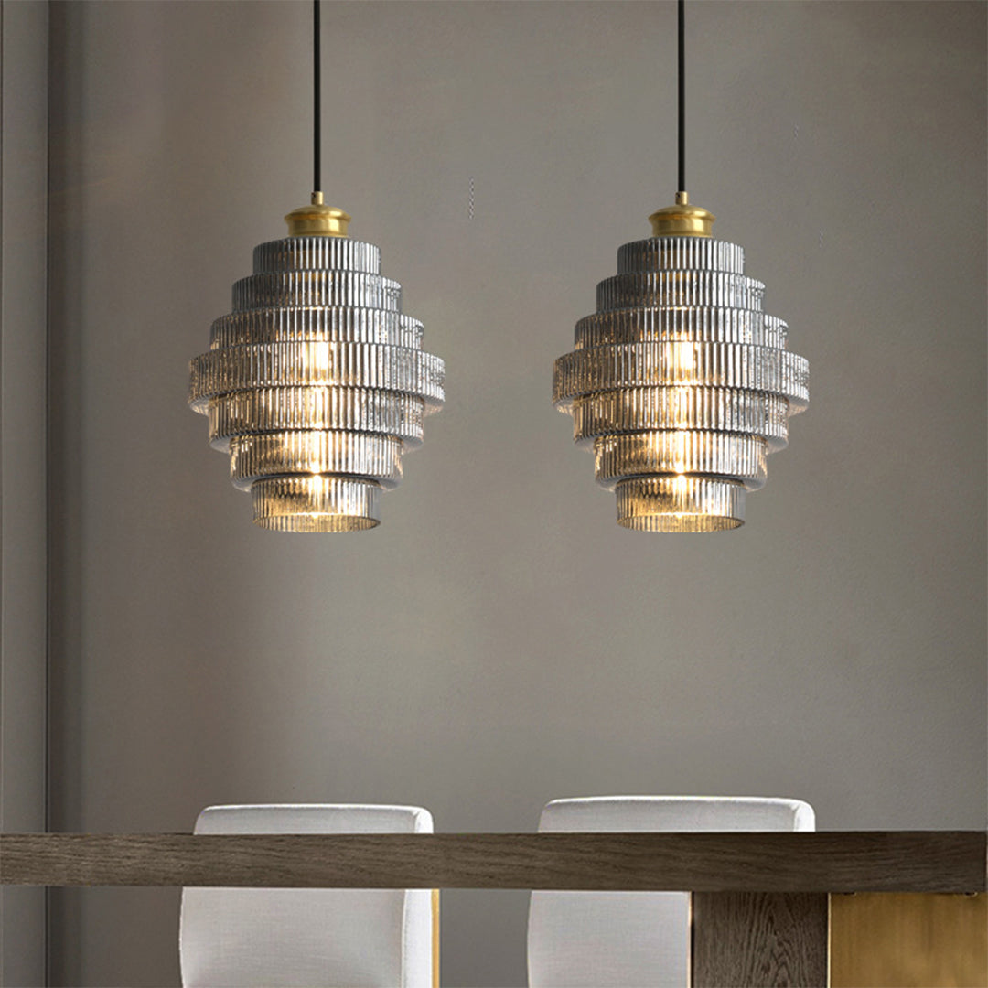 Pair of modern honeycomb pendant lights in a dining area, elegant and geometric lighting fixtures