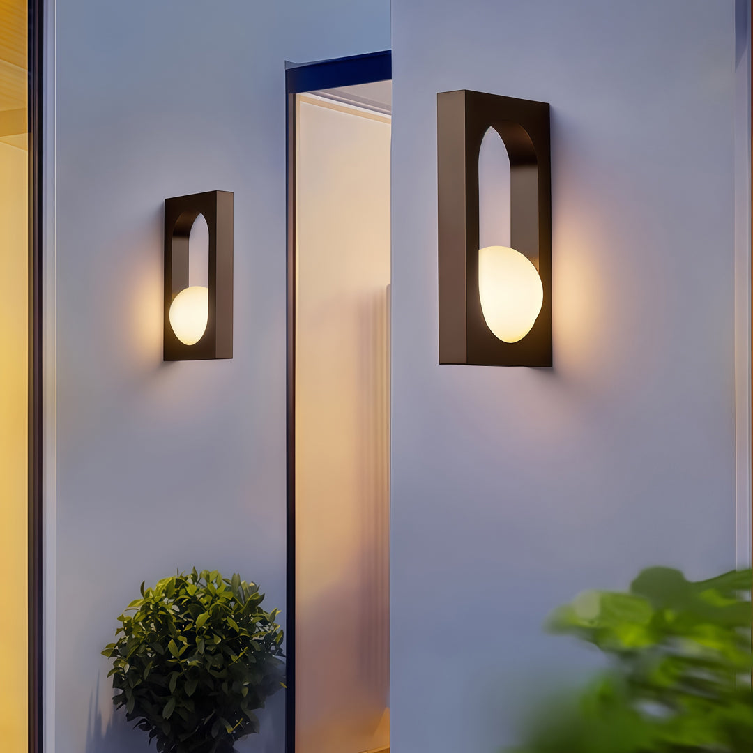 Pair of matching outdoor wall lights installed along a garden pathway, showcasing balanced and stylish led outdoor wall lighting ideas.