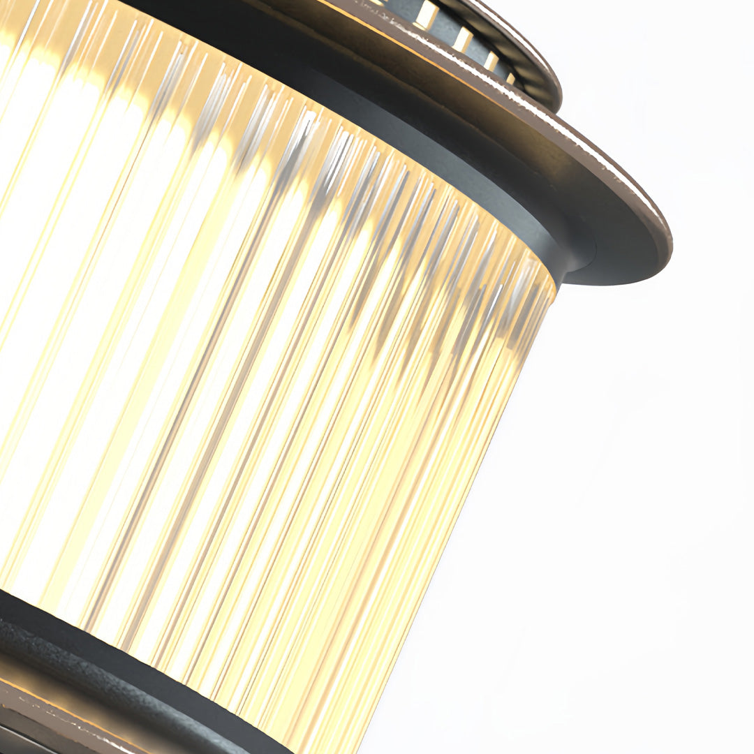 A pair of stainless steel pillar lights enhancing the entryway of a modern home, creating a stylish and safe environment.