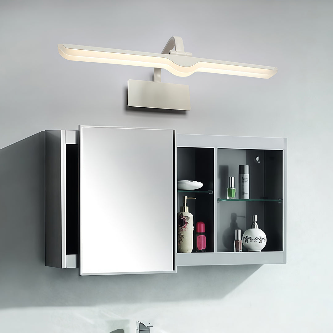 Pair of white bathroom vanity lights flanking medicine cabinets in contemporary grey bathroom.