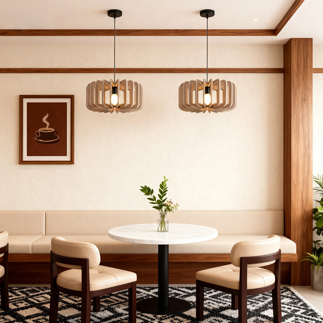 Pair of wooden slat Nordic pendant lights over a small round table in a cozy cafe setting 