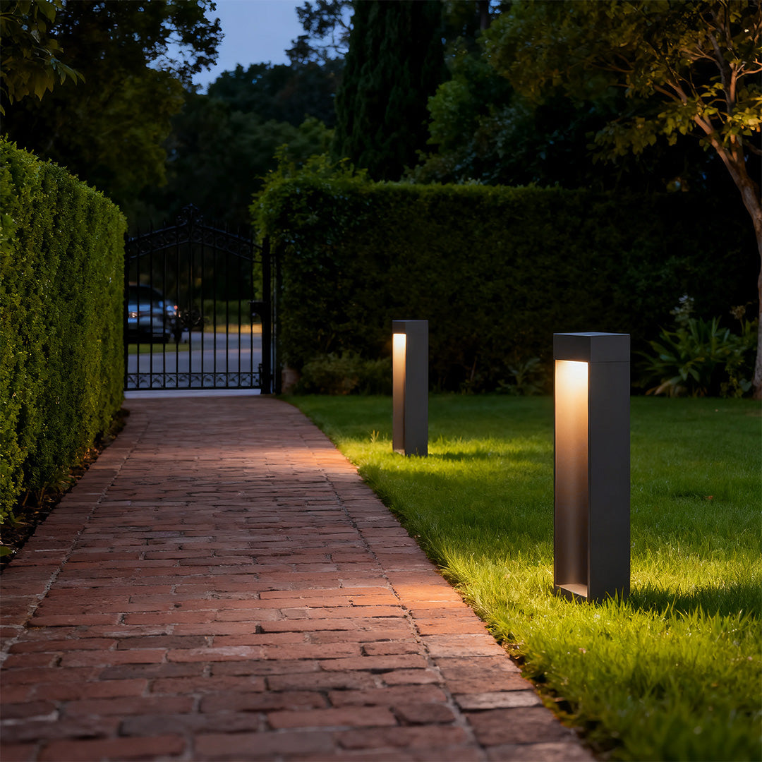 Path light stake along a garden pathway, offering stylish and functional lighting.