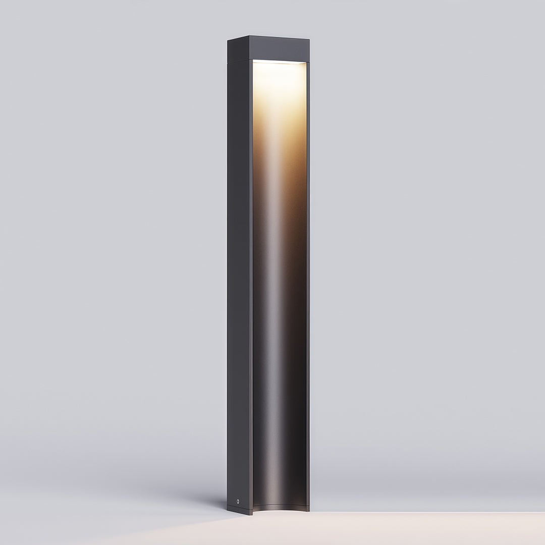 Path light stake featuring a minimalist black rectangular design and a soft light glow.