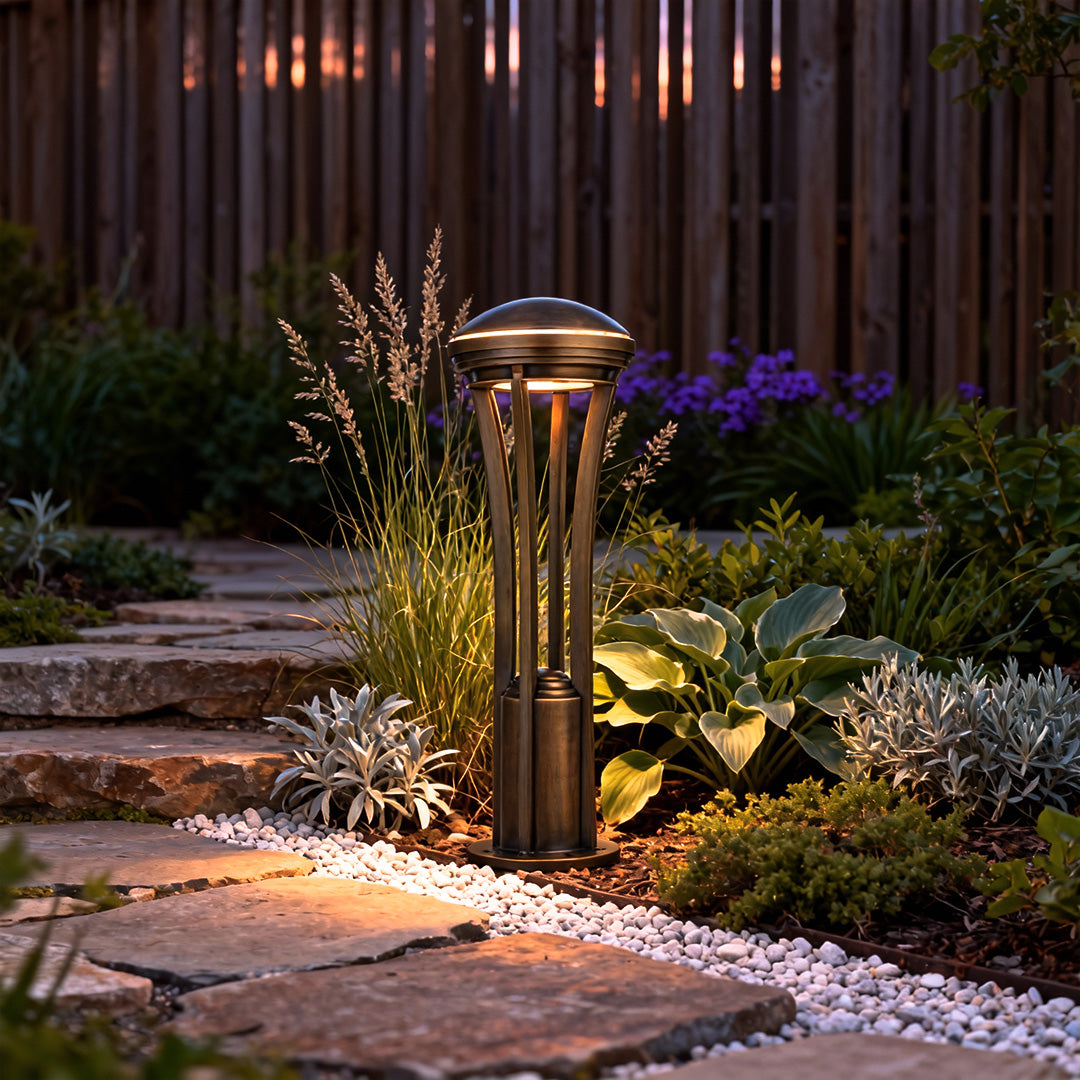 Path light stakes placed beside plants and gravel, delivering soft ambient lighting for outdoor garden paths.