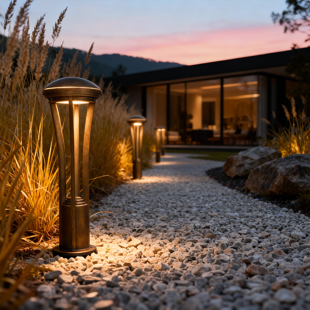Path light stakes illuminating a residential outdoor walkway at dusk, enhancing safety and visual appeal.