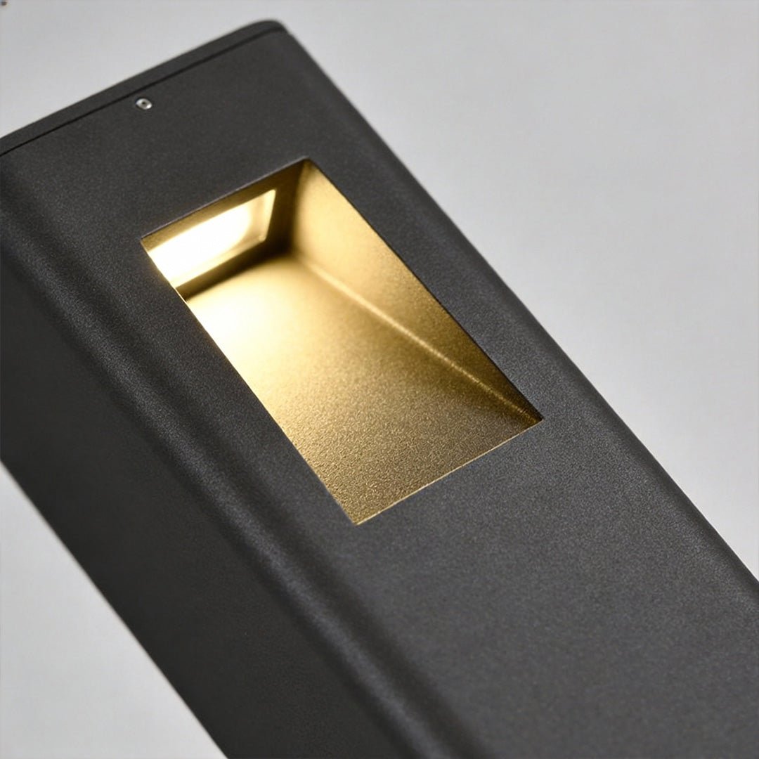 Pathway bollard light with a rectangular cutout, highlighting its contemporary style.
