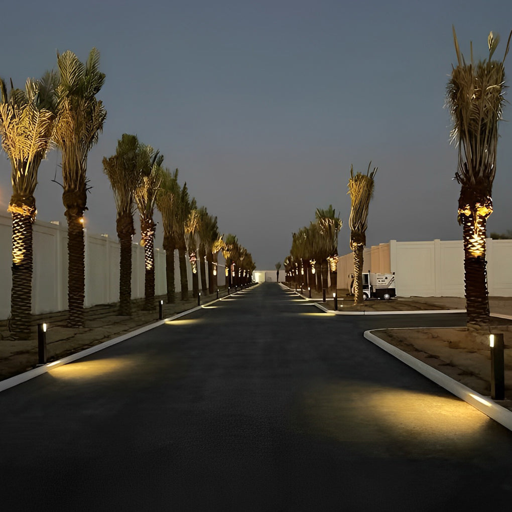 Alt Way bollard lights lining a poolside path, creating a serene and inviting atmosphere.