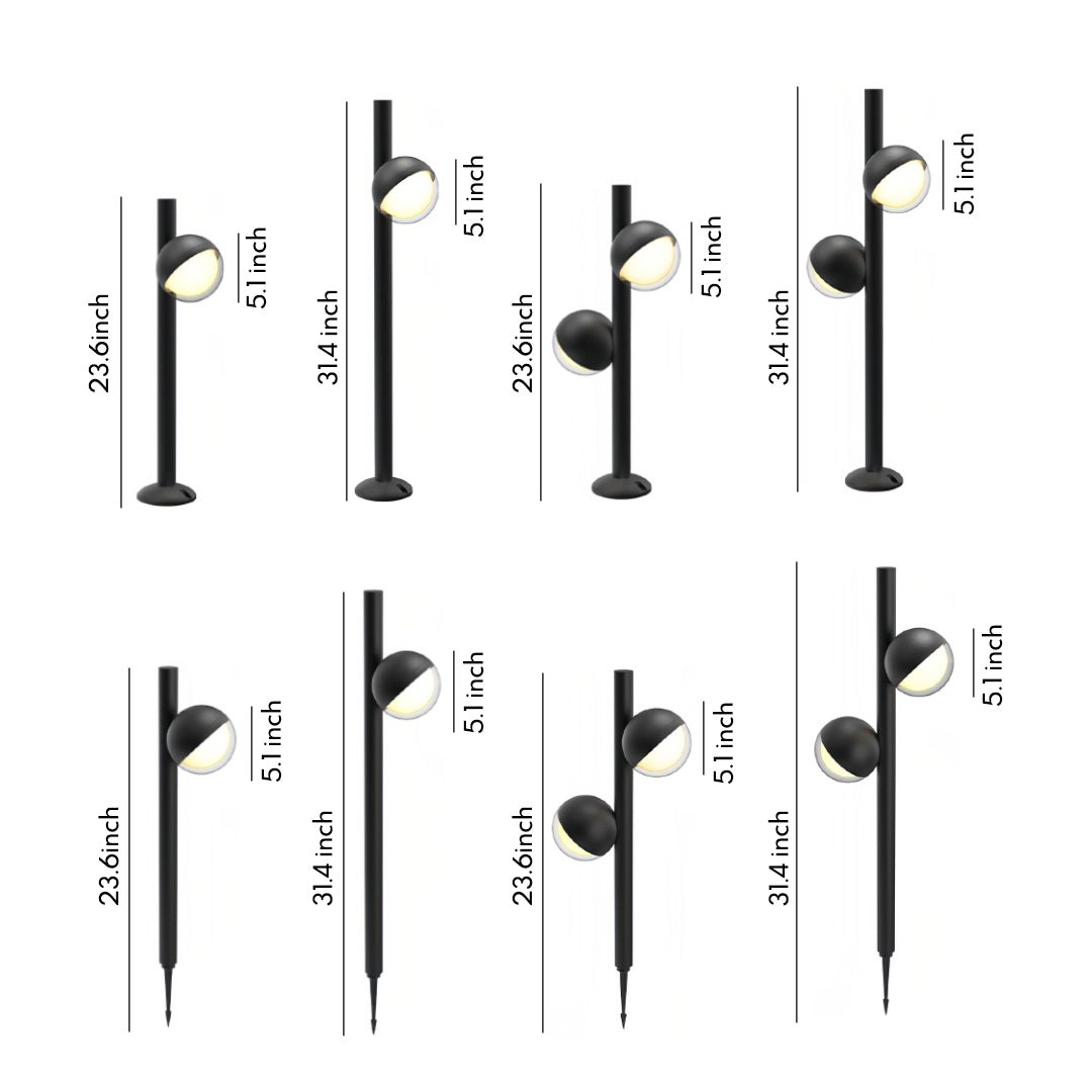 Pathway landscape lighting installed along gravel border at night creating dramatic illuminated walkway effect