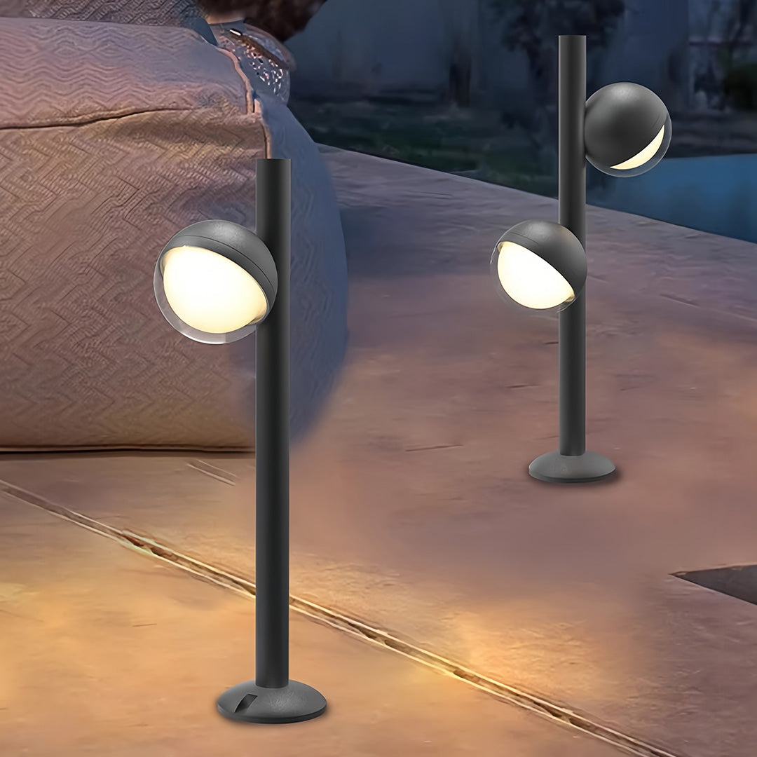 Pathway landscape lighting installed beside patio seating area with dual fixtures providing functional outdoor illumination