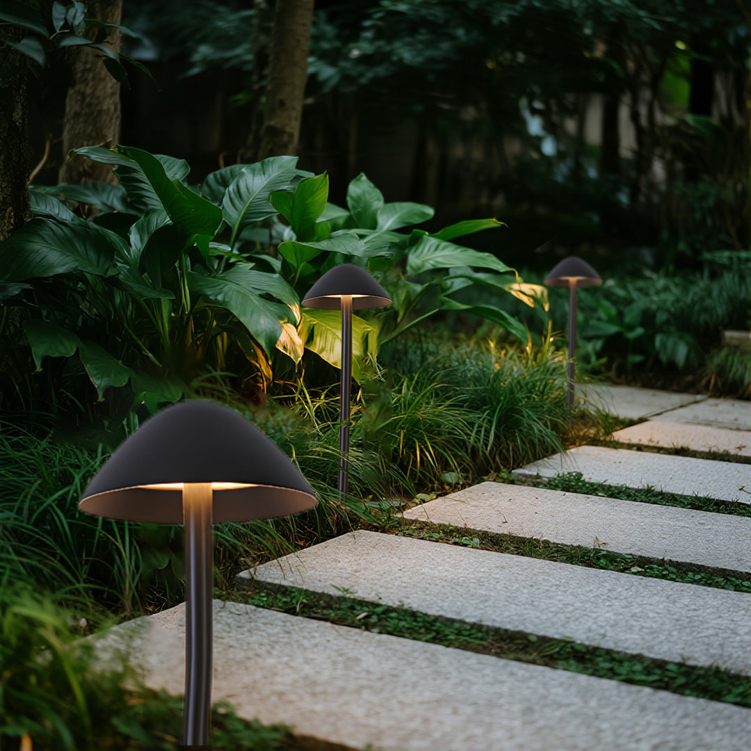 Modern pathway mushroom garden lights integrated seamlessly into lush tropical landscape design with decorative plants