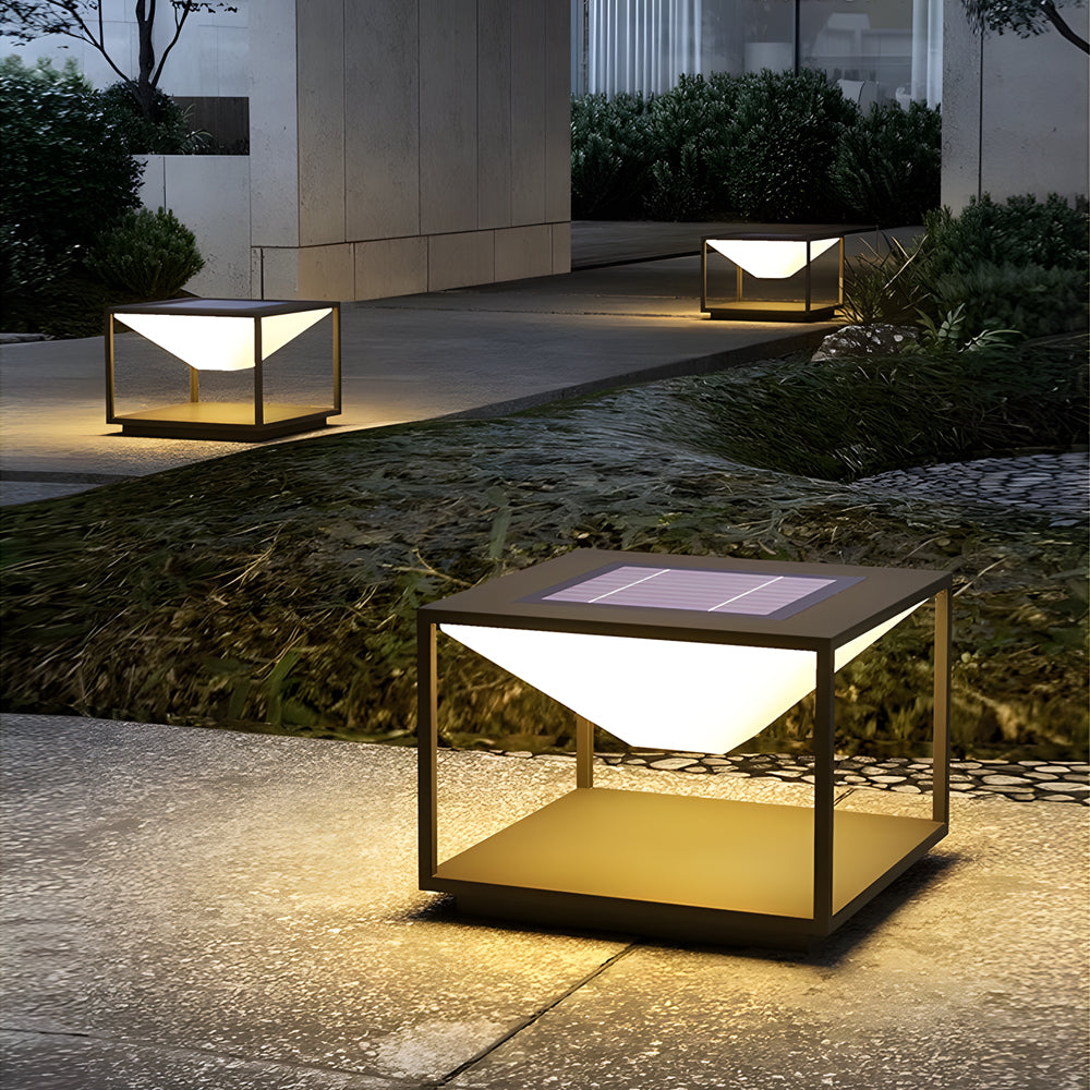 Contemporary solar pillar light installation providing elegant pathway illumination in modern landscape garden setting