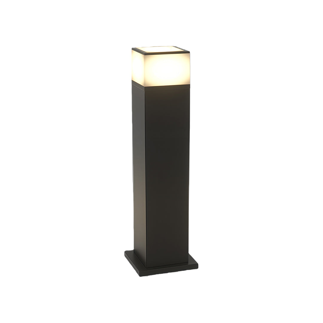 Pathway yard light featuring a minimalist black square design and a soft light glow.