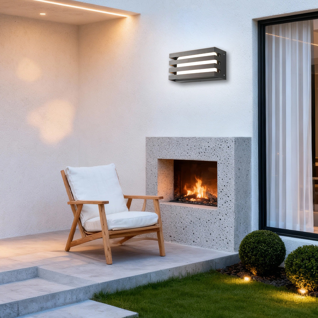 Warm ambient outdoor wall lights LED mounted on a patio wall, enhancing the cozy outdoor seating area.