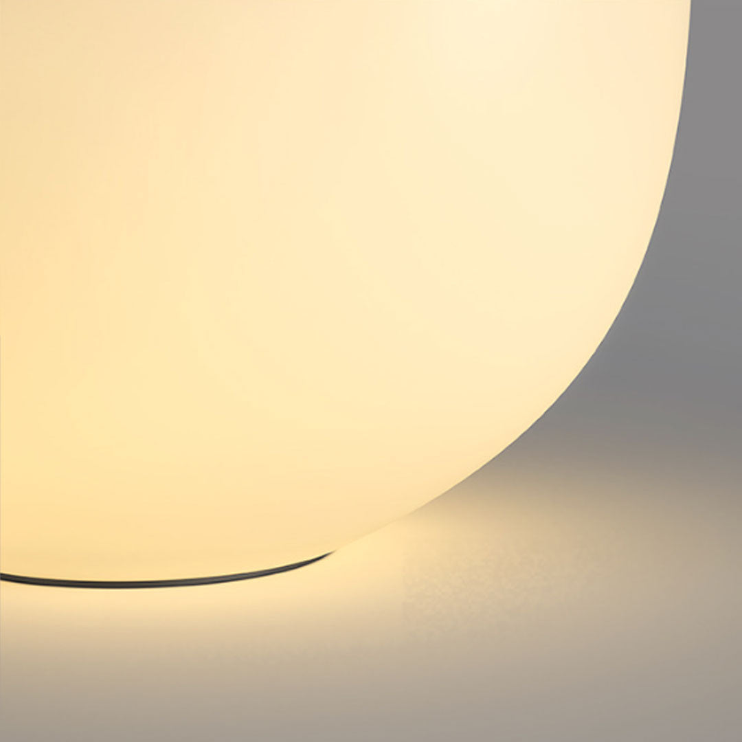 Patio outdoor floor lamps close-up featuring soft ambient illumination and sculptural organic shape.
