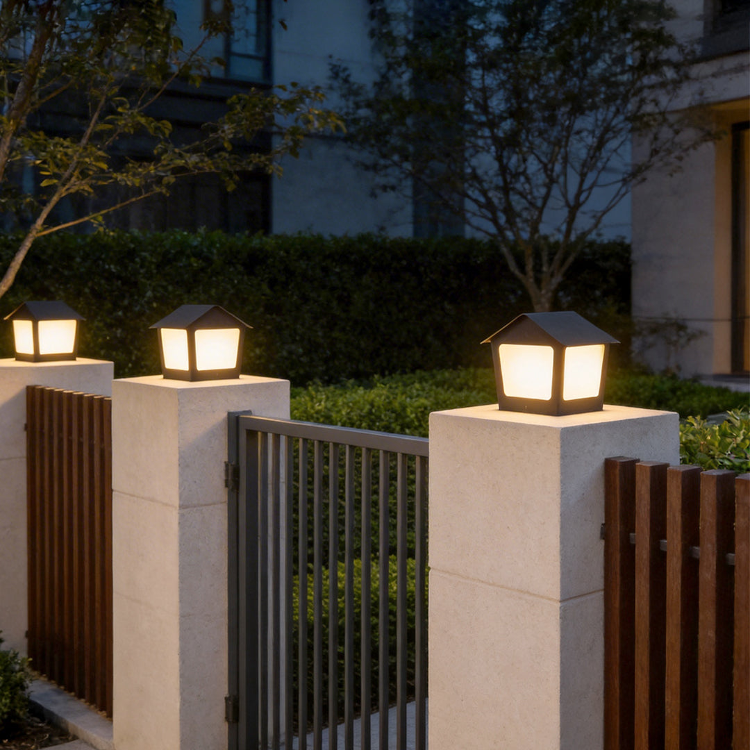 Patio pillar lights enhancing a contemporary outdoor fence with elegant directional light.