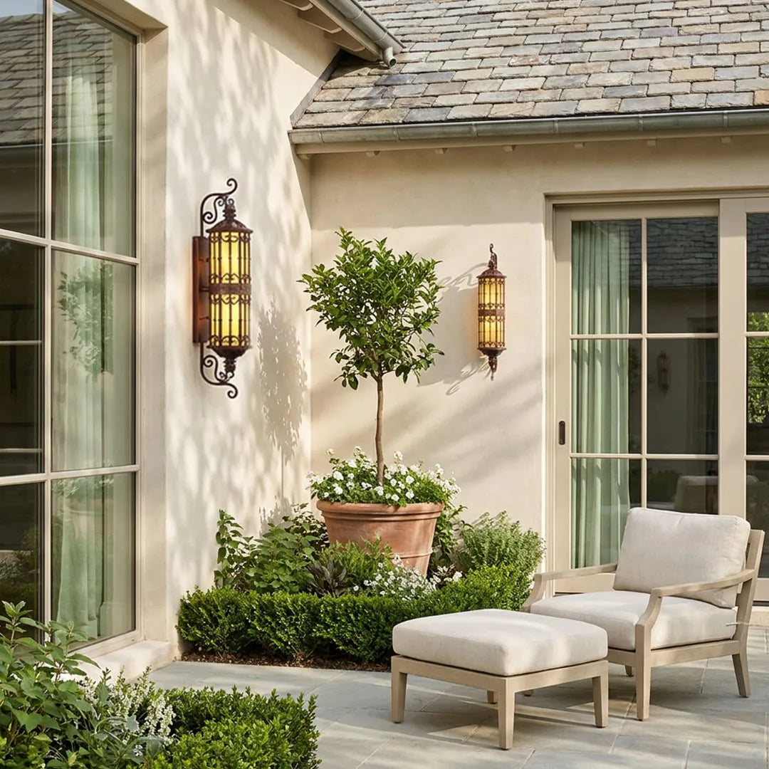 Vintage wall sconce lighting mounted beside patio doors with ornate lantern-style details.