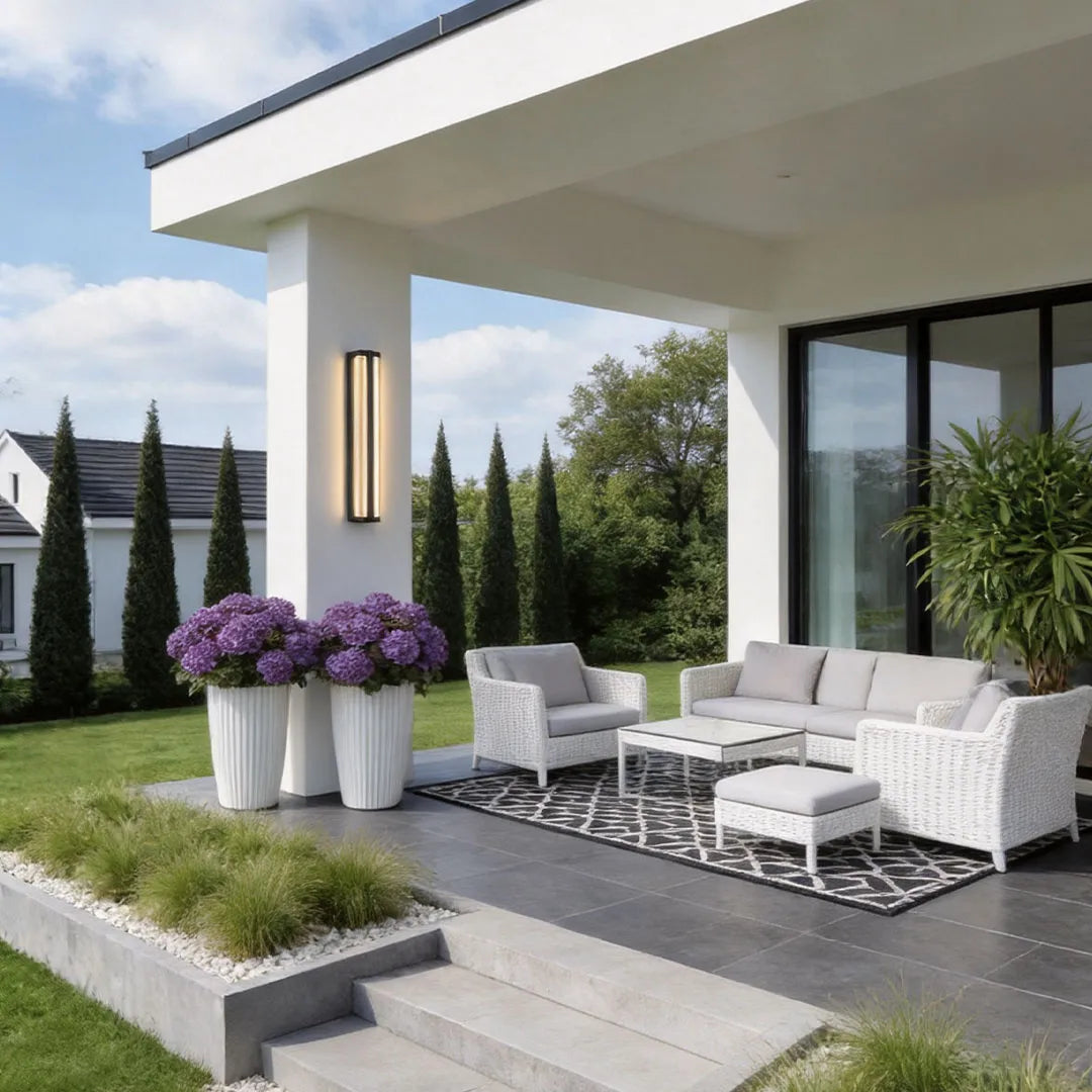 Modern wall mount outdoor lighting enhancing a contemporary patio and exterior wall.