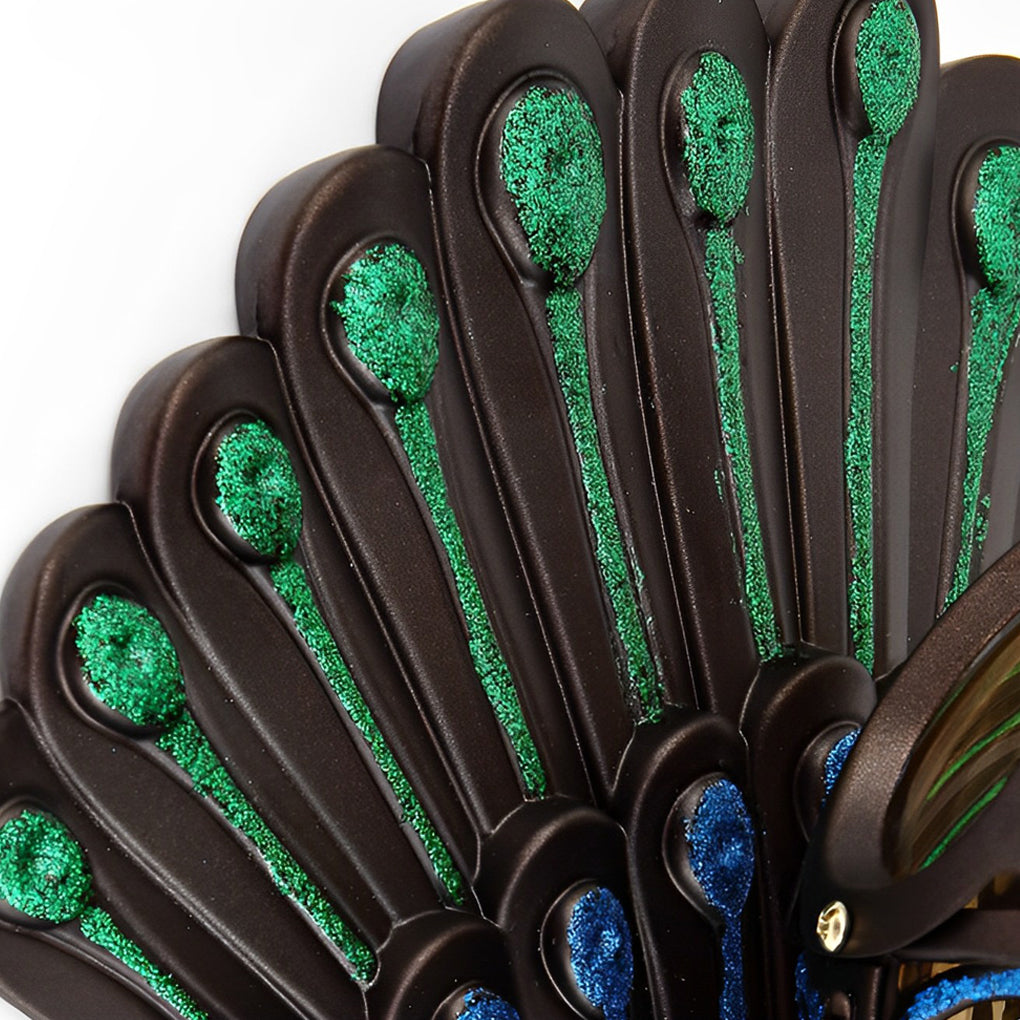 Peacock wall light feather backplate with green and blue accents.