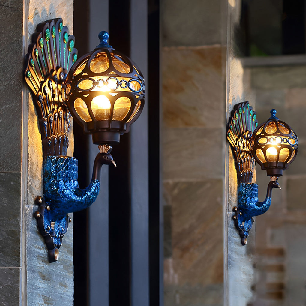 Pair of peacock wall lights mounted along outdoor corridor wall.