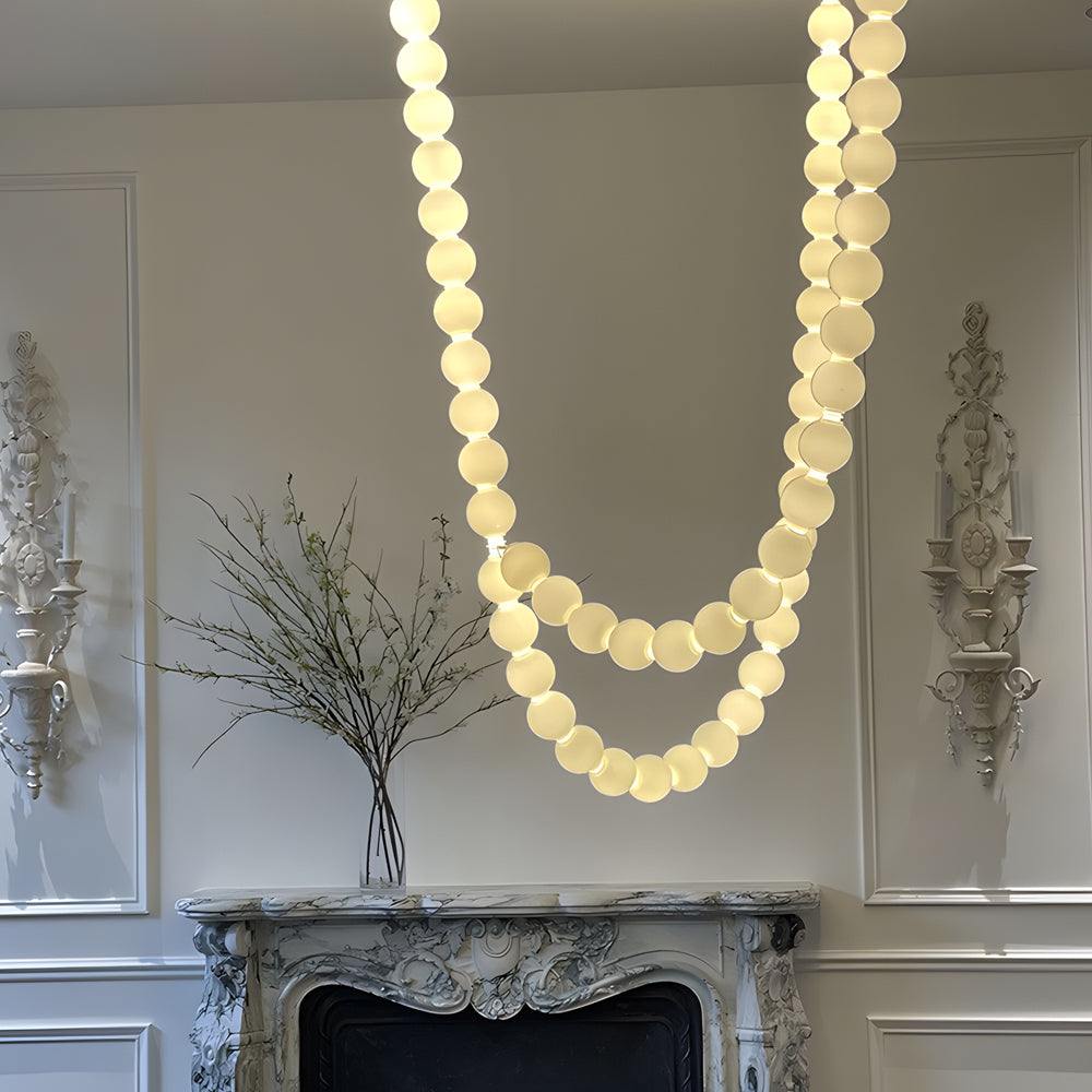 Pearl necklace light fixture with a white pearl design, providing ambient lighting.