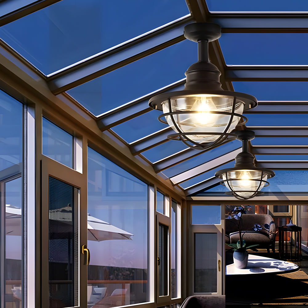 Modern pergola with multiple coastal semi flush mount ceiling lights providing elegant outdoor dining area illumination