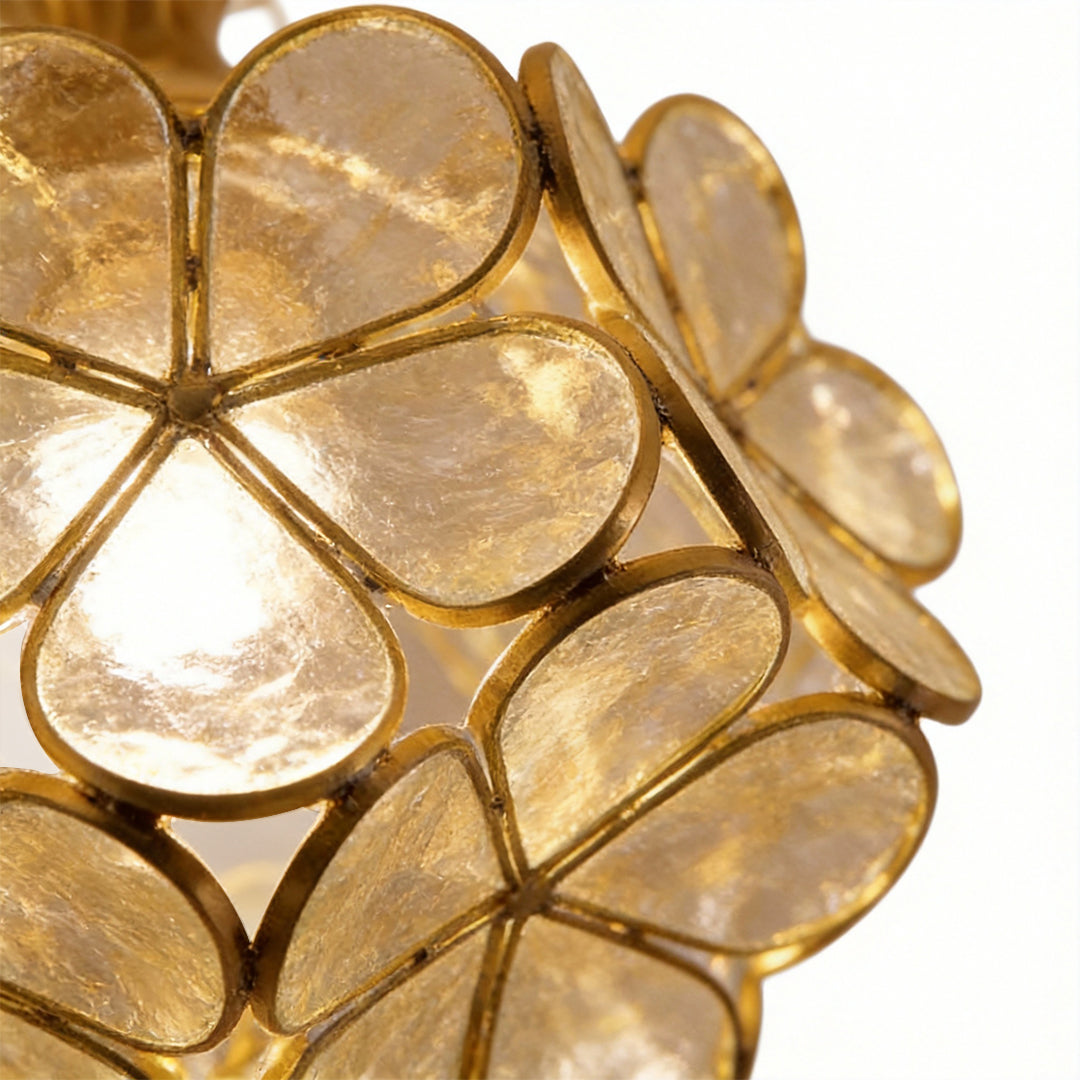 Petal shaped ceiling lights in gold, close-up of the intricate petal design.