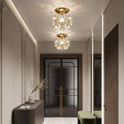 Petal shaped ceiling lights illuminating a modern hallway with warm, elegant glow.