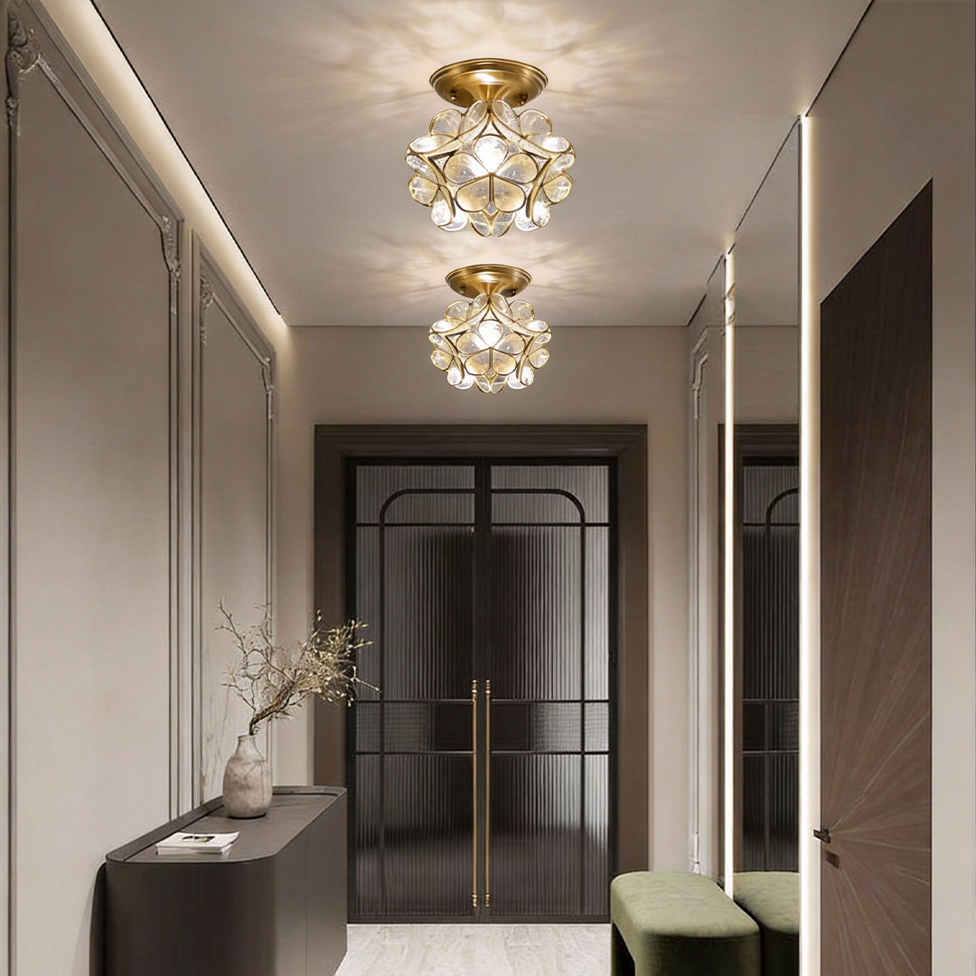 Petal shaped ceiling lights illuminating a modern hallway with warm, elegant glow.