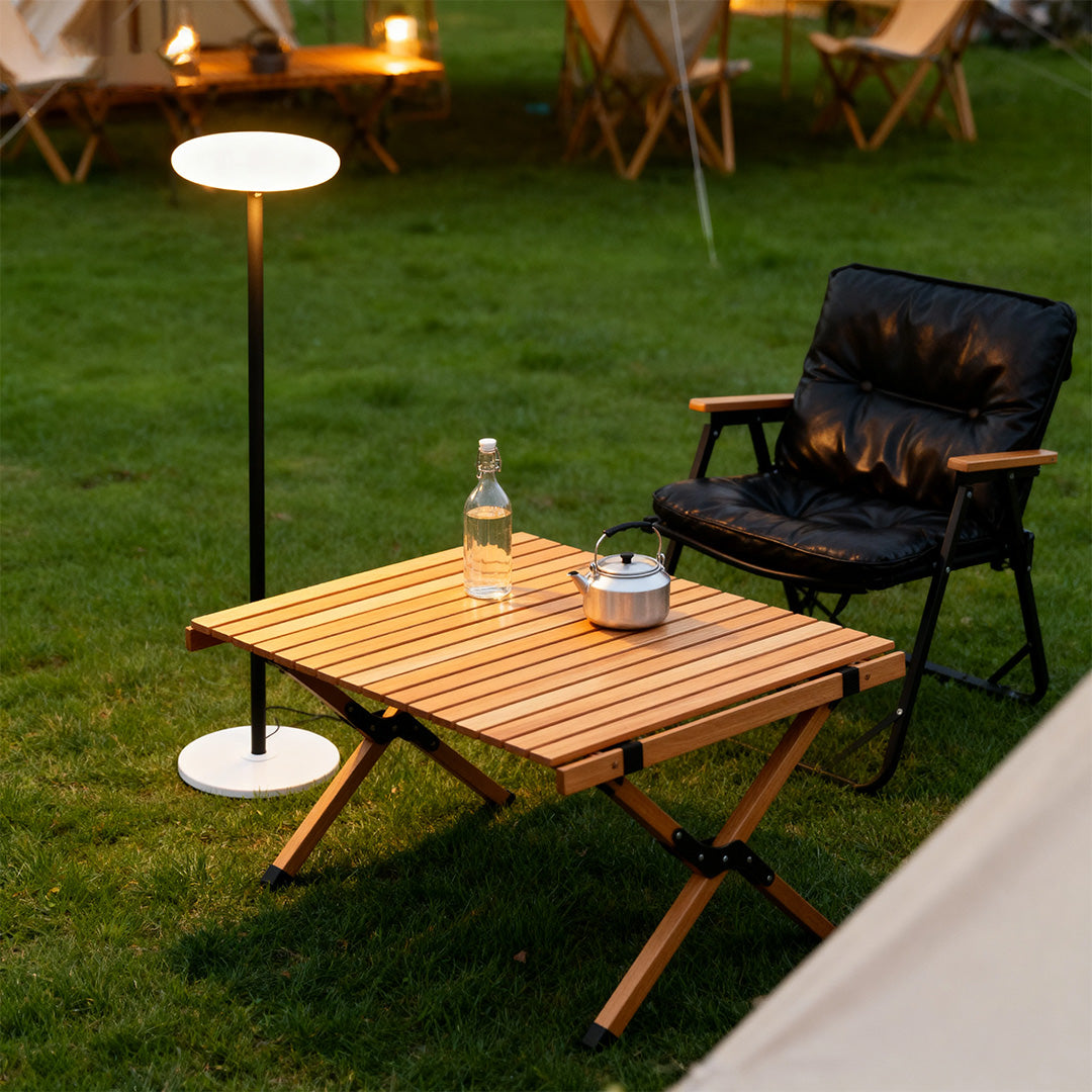 Outdoor patio floor lamp beside a picnic table, functional lighting for garden parties