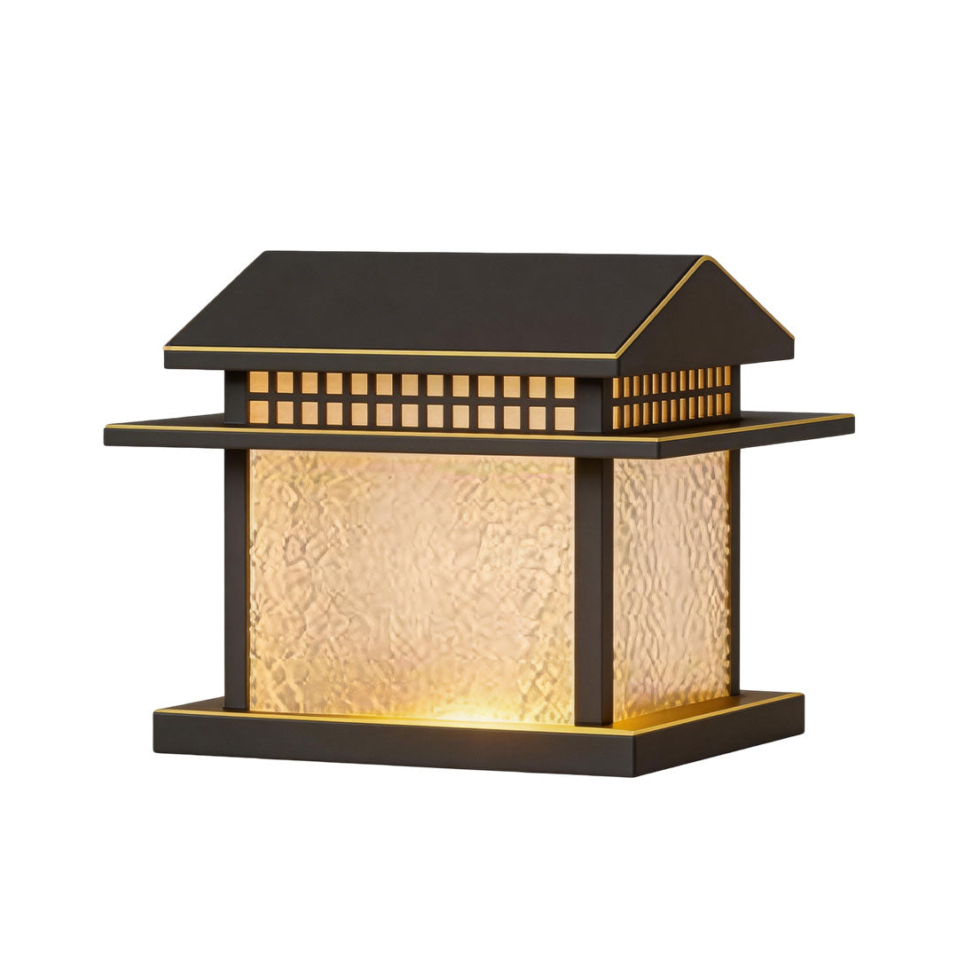 Pillar lamp light with a black frame and frosted glass, providing soft outdoor lighting.