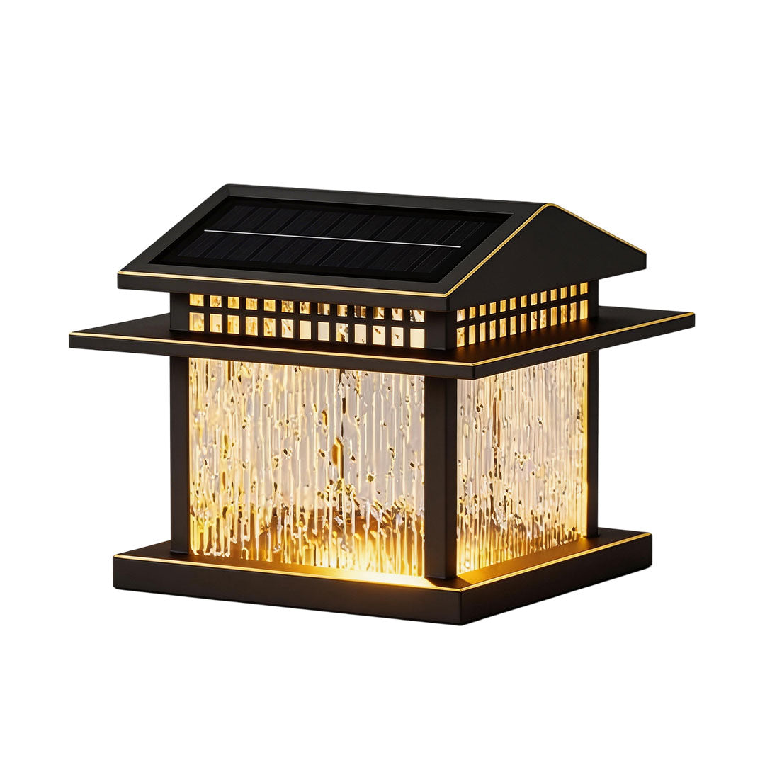 Elegant pillar lamp light with golden accents and glass panels, perfect for garden illumination.