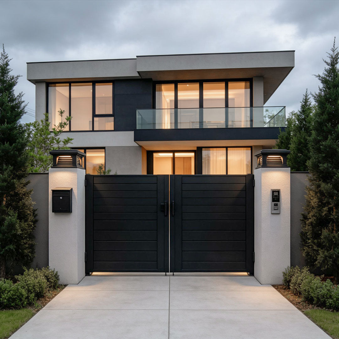Stylish pillar light design outdoor illuminating the entrance of a modern house with black accents.