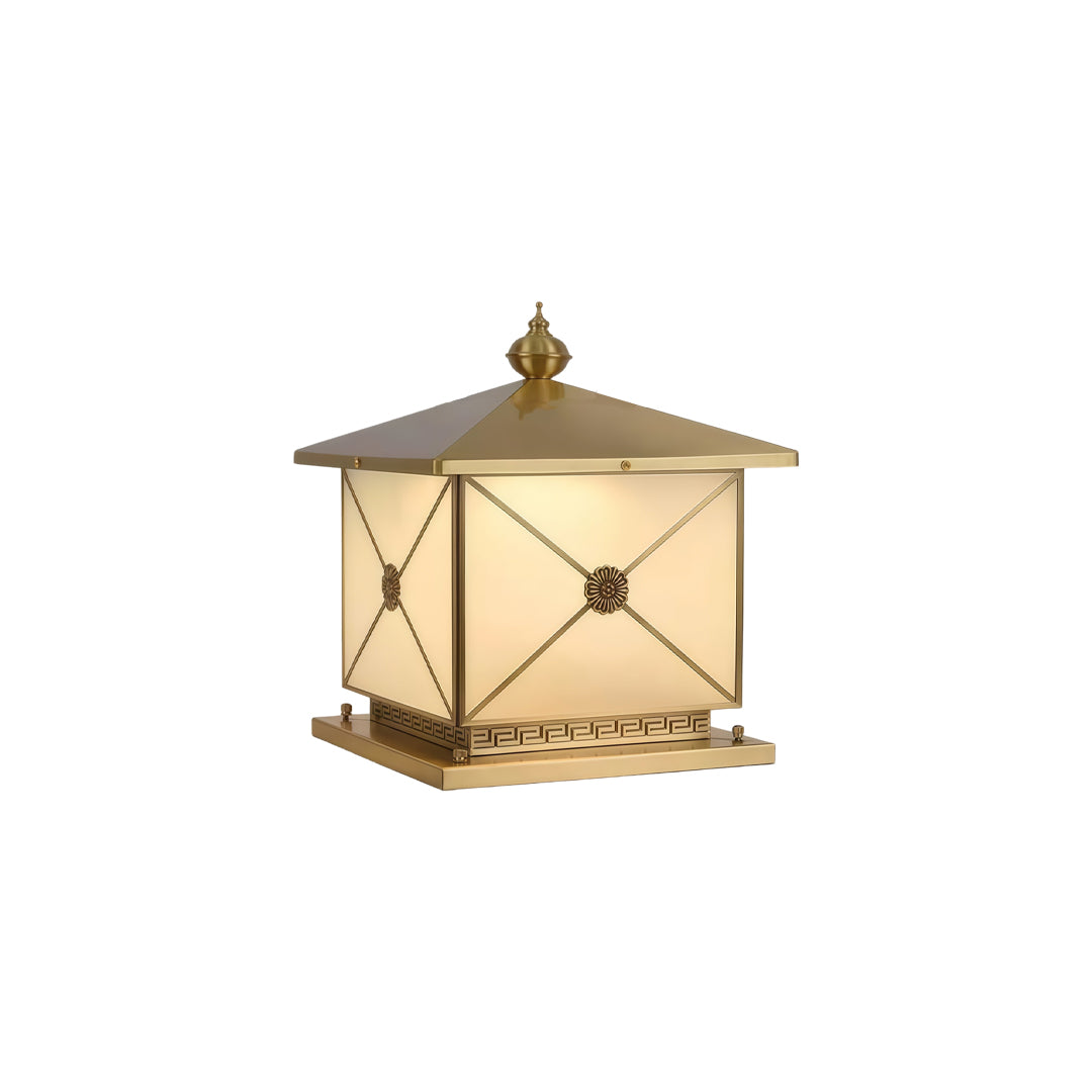 Modern pillar light solar in gold finish isolated on white background with soft warm lighting.