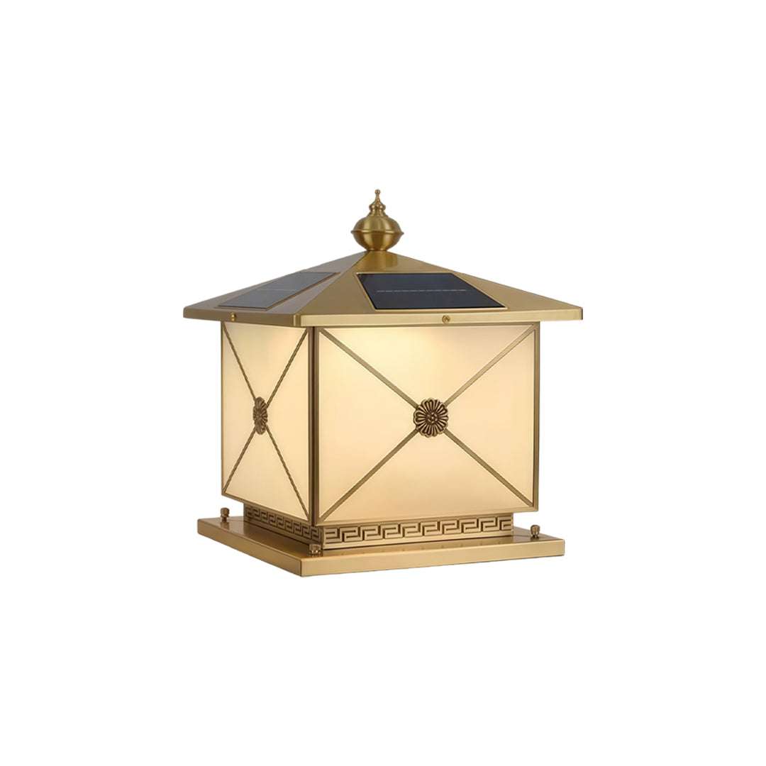 Stylish pillar light solar featuring warm internal glow and decorative patterned metal base.