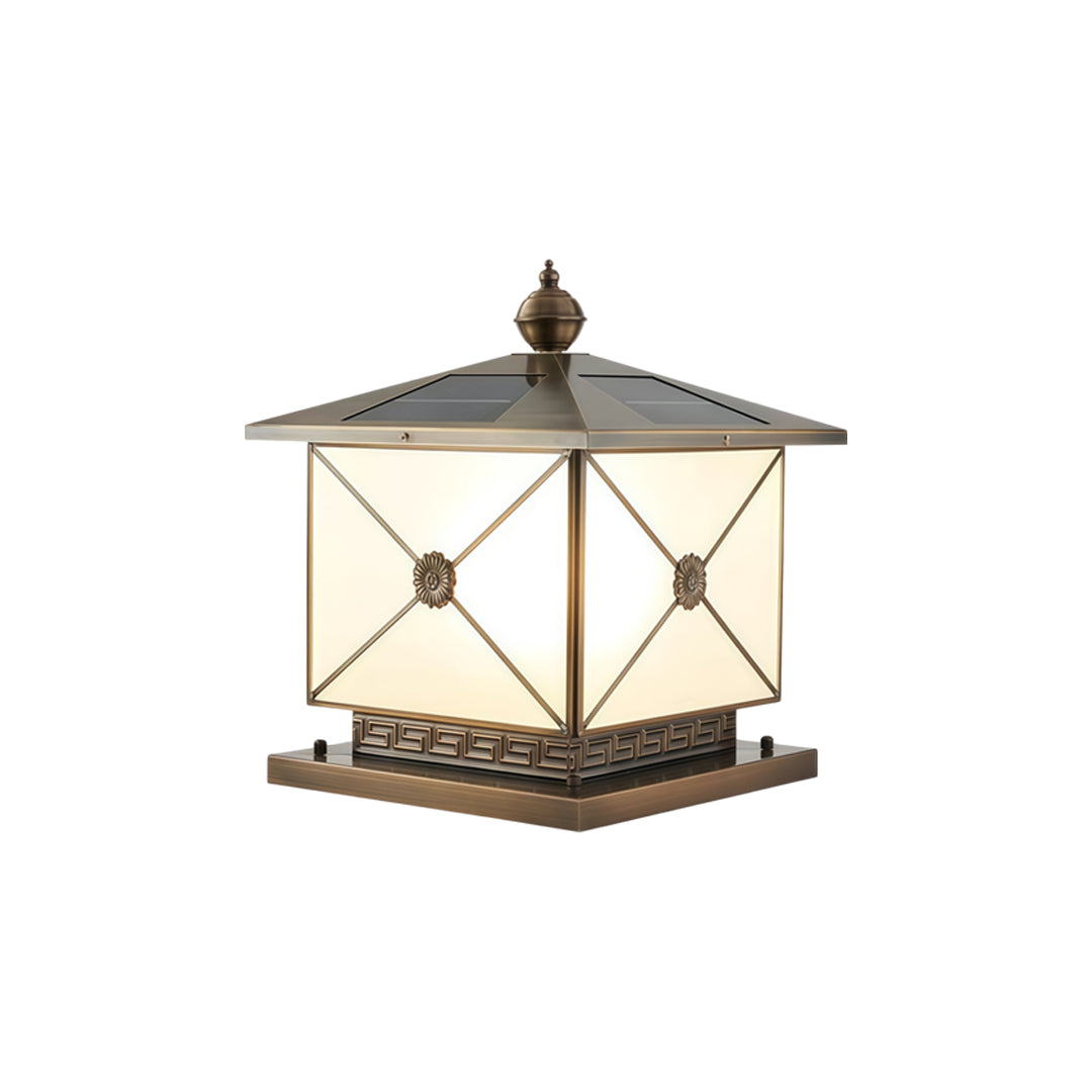 Decorative pillar light solar with warm LED glow and patterned metallic trim accents.