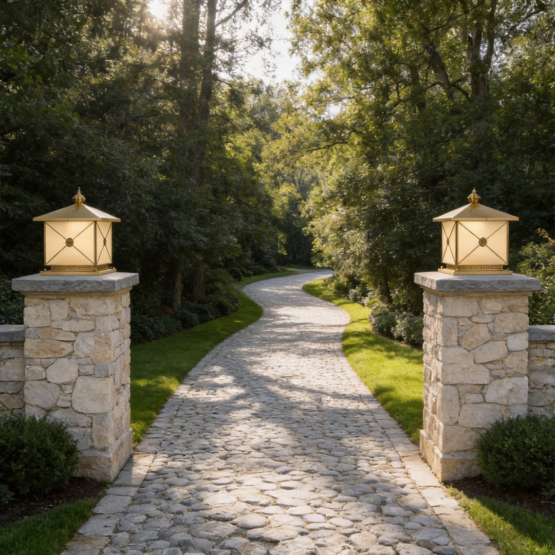 Elegant pillar light solar installed on stone entrance columns along a luxury garden pathway.