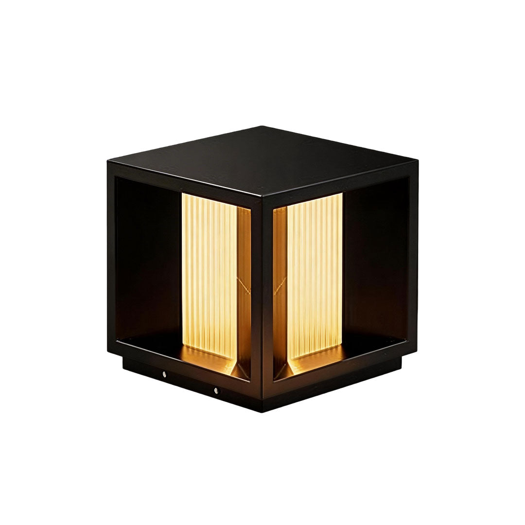 Pillar lighting with a black base and illuminated top, ideal for garden pathways.