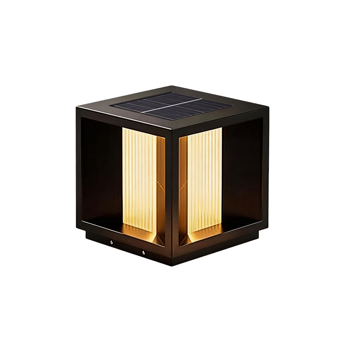 Pillar lighting with a black metal frame and illuminated sides for garden ambiance.