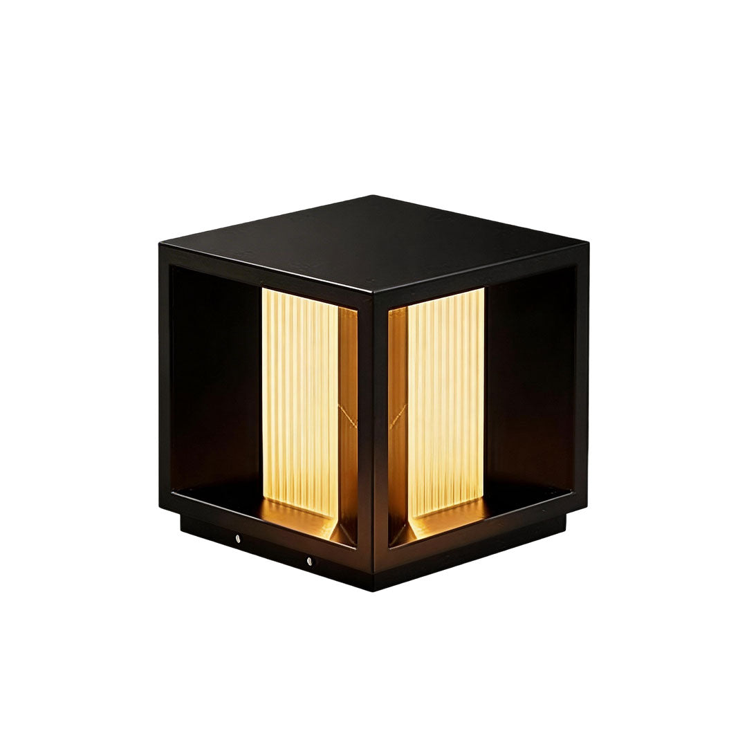 Modern pillar lighting with a geometric design and warm yellow light for garden pathways.